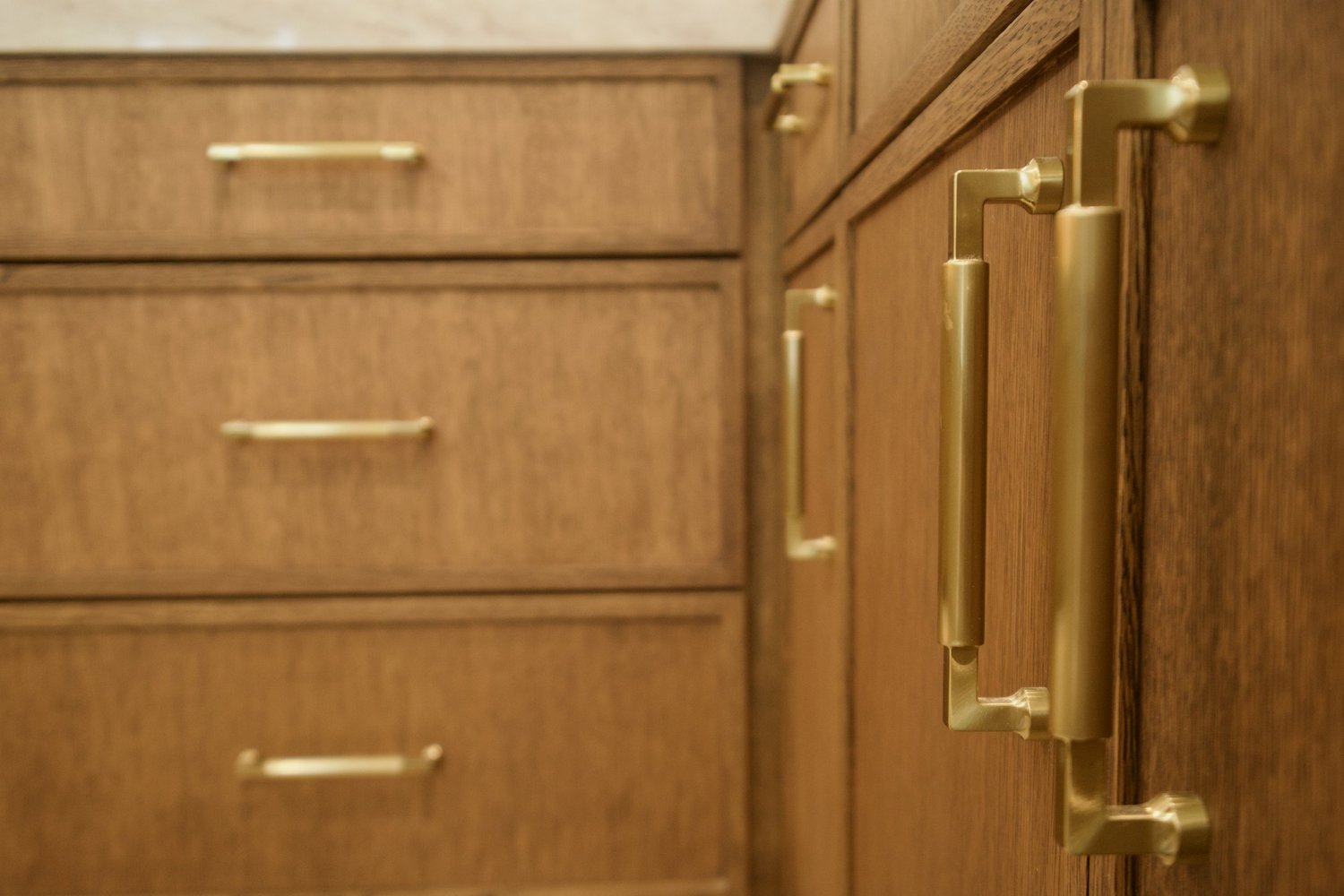 Custom cabinetry and brass hardware from the San Marcos whole-home renovation